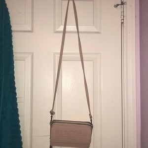 A pink reaction Kenneth Cole purse